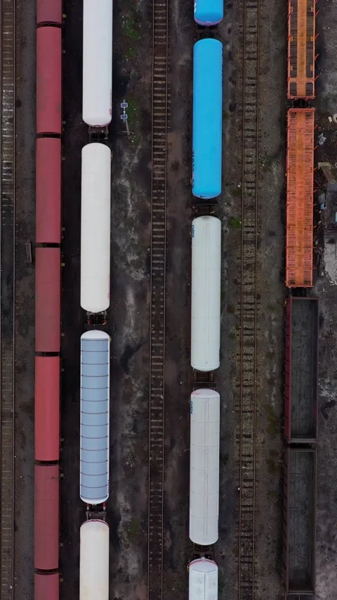 Top down aerial view of a train track and trains for transportation 스톡 동영상 294793632