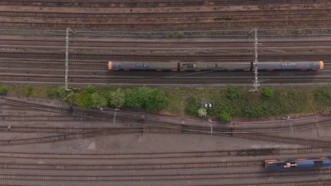 Top Down Aerial View of Train Moving on Railway Tracks Stock-Footage 334008458
