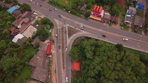 Top down aerial view of a triangular highway intersection 스톡 동영상 334925759