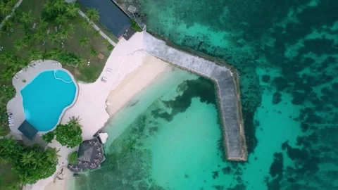 Top-down aerial view of tropical beach and resort pool, Philippines Video stock 325217615