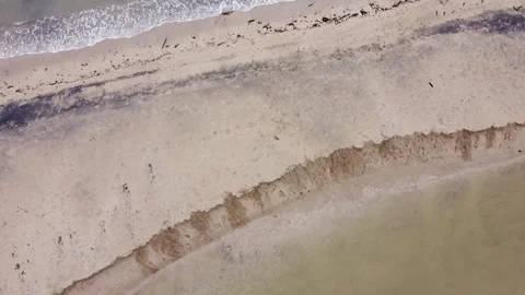 Top Down Aerial View of Tropical Beach Shoreline with Waves Indonesia Upward Stockbeeldmateriaal 331011037