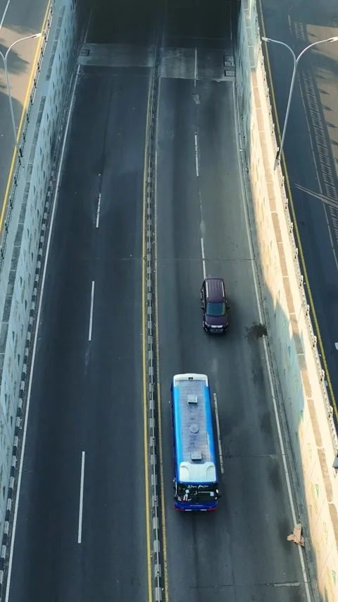 Top down aerial view of truck traveling across urban overpass Stock Footage 346739286