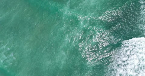 Top Down Aerial View of Turquoise Ocean Waves and Sea Texture Stock Footage 330716716