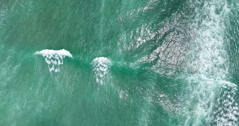 Top Down Aerial View of Turquoise Ocean Waves and Sea Foam Texture Stock Footage 330716762