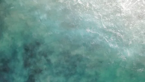 Top down aerial view of turquoise ocean and cliffs Stock Footage 336006865