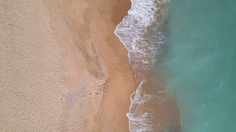 Top Down Aerial View of Turquoise Sea Waves Splashing Sand Beach Stockbeeldmateriaal 347067016