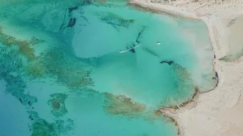 Top down aerial view of turquoise sea lagoon with beautiful sandy bottom an.. Stock Photos