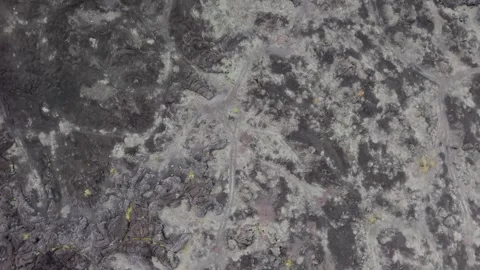 Top down aerial view of volcanic black lava field texture Stock Footage 337751209