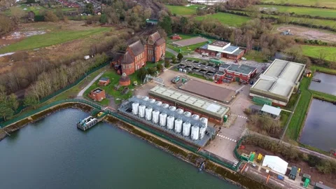 Top down aerial view of a water treatment plant featuring anaerobic digestion Stock Footage 338029482