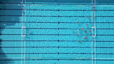 Top Down Aerial View of Water Polo Players Passing Ball During Match Game 스톡 동영상 343512323