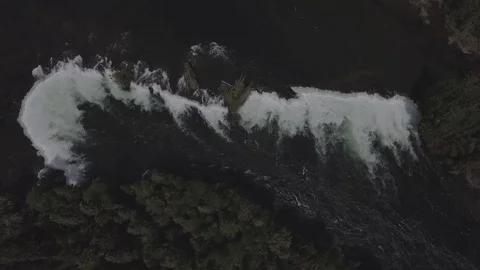 Top down aerial view from a waterfall to a small dock Stock-Footage 71114688