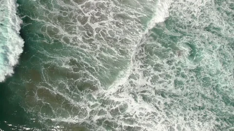 Top down aerial view of waves and turquoise water off the Oregon coast. Video stock 115326832