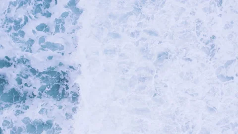 Top down aerial view of waves crashing and foaming. Sea water surface texture Stock Footage 221822452