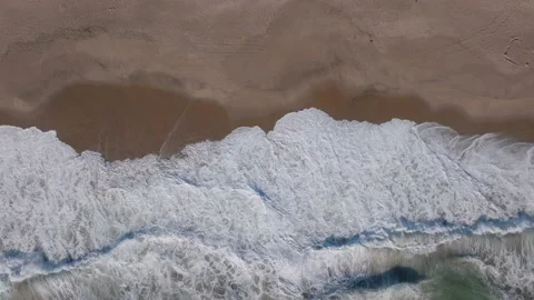 Top down aerial View Of Waves Crashing On a tropical Beach Stock Footage 238724106