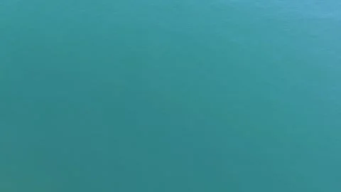 Top Down Aerial View of Waves Meeting Sandy Beach Stock Footage 325292664