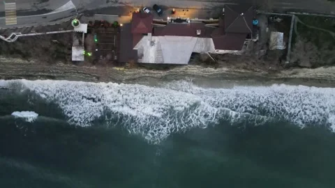 Top-down aerial view of waves crashing against the rocky cliffs in Gelendzhik Stock Footage 337171857