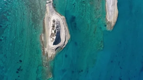 Top-Down Aerial View of White Rock Islets in Turquoise Water, Cape Drastis Stock-Footage 345001435