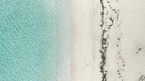 Top Down Aerial View of White Sand Beach and Turquoise Sea Water Stock Photos