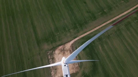 Top Down Aerial View of Wind Turbine and Shadow on Green Field Stock-Footage 331928865