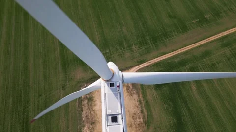 Top Down Aerial View of Wind Turbine and Shadow on Green Field Video stock 331928892