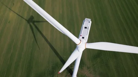 Top Down Aerial View of Wind Turbine and Shadow on Green Field Video stock 331928969