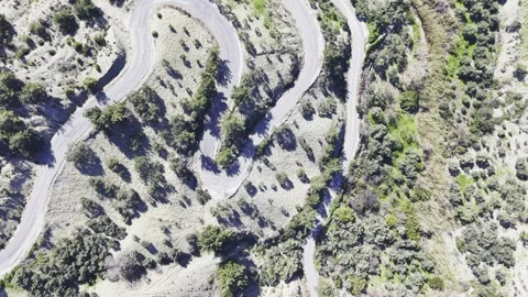 Top-Down Aerial View of Winding Mountain Road - 4K Drone Stock Footage 331747624