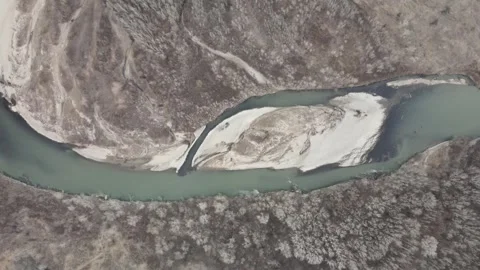 Top-down aerial view of a winding river with a sandy island Stock Footage 337394723