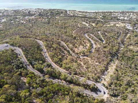 Top down aerial view of winding mountain road Foto stock