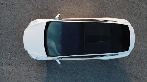 Top down aerial view on zero emission modern electric vehicle parking in urban Stock Footage 277412623