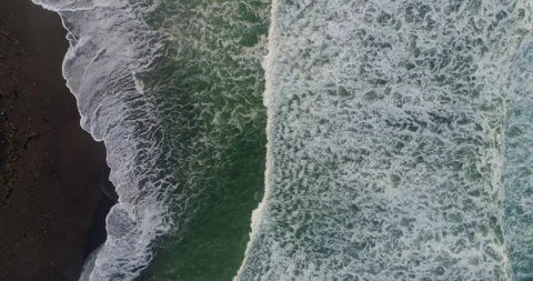 Top Down Aerial of Waves Forming Abstract Patterns on Sand 스톡 동영상 332150669
