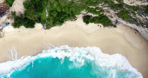 Top Down Aerial of Waves on Sandy Beach at Kelingking Beach, Nusa Penida Bali Stock Footage 331214157