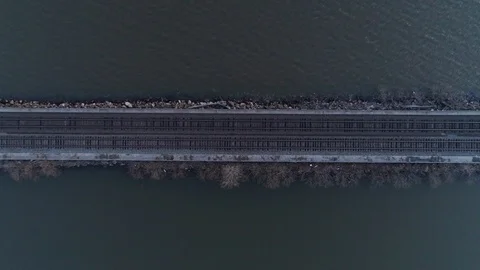Top Down Aerial Zoom Out of Train Tracks Over Hudson River Stock Footage 94657155