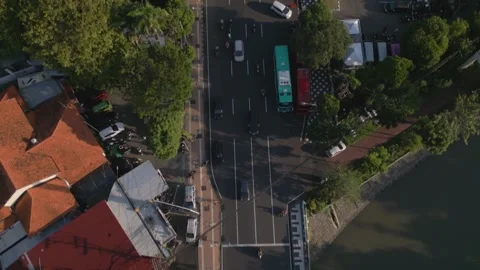 Top down and tilt up view of road and bridge crossing in downtown Surabaya Stock Footage 338038918