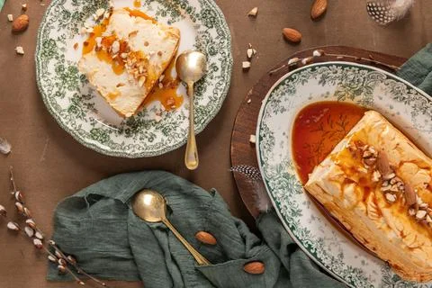 A top-down arrangement showcases a slice and a whole traditional caramelize.. Stock Photos