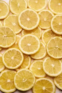 Top down background view made of Fresh Sliced organic lemons close-up Stock Photos