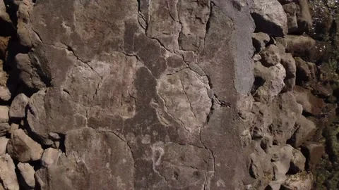 Top down backwards view along the pier with fisherman in Caparica, Portugal 4K Stock Footage 154457189