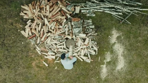 Top Down Birds Eye View Of Man Chopping Wood Splitting A Log With An Axe Video stock 238549956