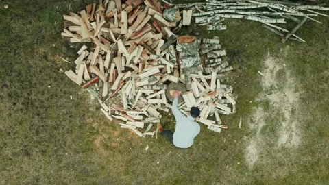 Top Down Birds Eye View Of Man Chopping Wood Splitting A Log With An Axe Video stock 238604337