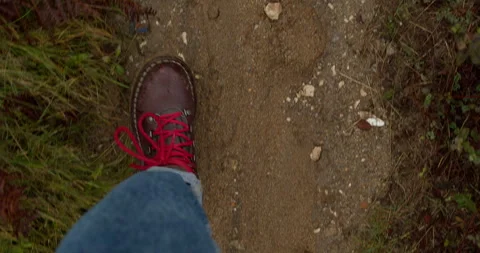 Top down on brown leather boots with red laces Stock Footage 265766969