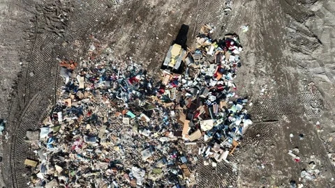 Top Down Bulldozer Pushing Trash at Landfill Stock Footage 304995117