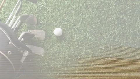Top-down camera clearing scanline noise and revealing white golf ball and irons Stock Footage 333925511