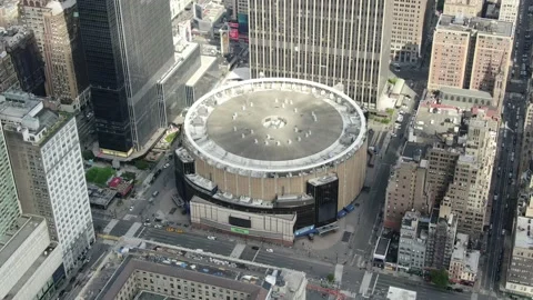 Top-down of a circular Midtown arena and dense city blocks Stock-Footage 130998981