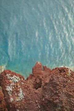 A top down of a cliff into the ocean Stock Photos