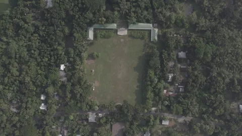 Top-Down to Close-Up Aerial Circle Shot of Rural School Field in Green Landscape Stock Footage 305876454