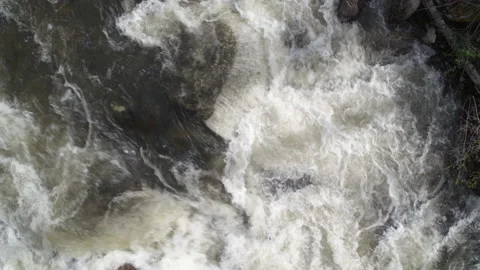 Top down close up aerial of white water creek and ascending Stock Footage 203930395