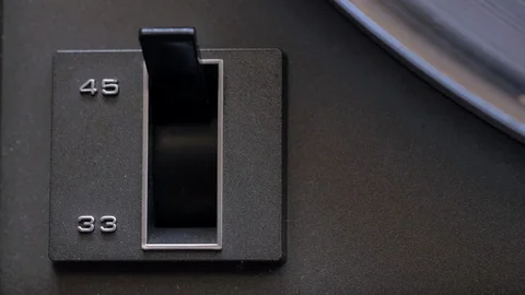 Top down close up shot of flipping turntable rpm switch Stock Footage 88763031