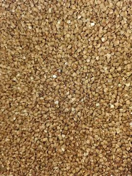 Top-down, close-up shot of a large quantity of dried, unprocessed buckwheat Stock Photos
