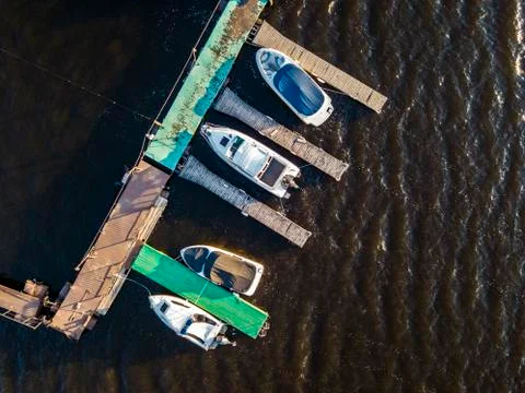 Top down close view of bunch of motor boats parked in the sea Stock Photos
