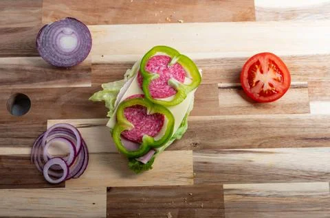 Top-down composition of diced onion on wooden background  food preparation .. Stock Photos