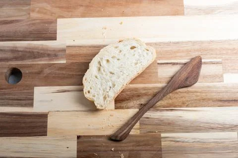 Top-down composition of sliced bread on wooden background  rustic food scene Stock Photos